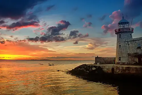 Sundown on Dublin Bay, with Howth Harbour Lighthouse on the right.