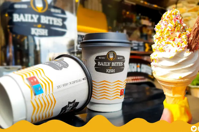 Close-up of Baily Bites at Kish coffee cups and ice-cream cone with flake and sprinkles.