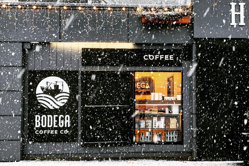 Bodega Coffee shopfront in Howth, with heavy snow falling.