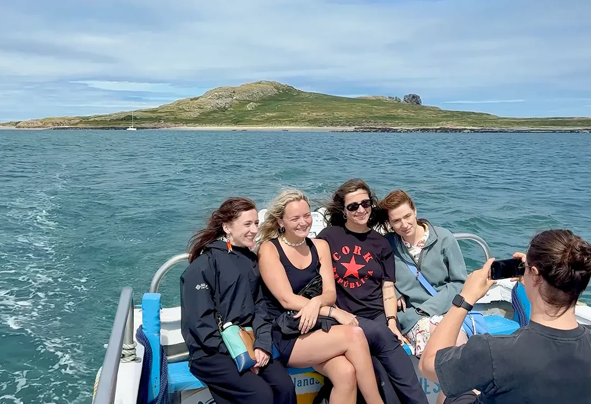 Group of women on-board Ireland's Eye Ferry pose for a photo.