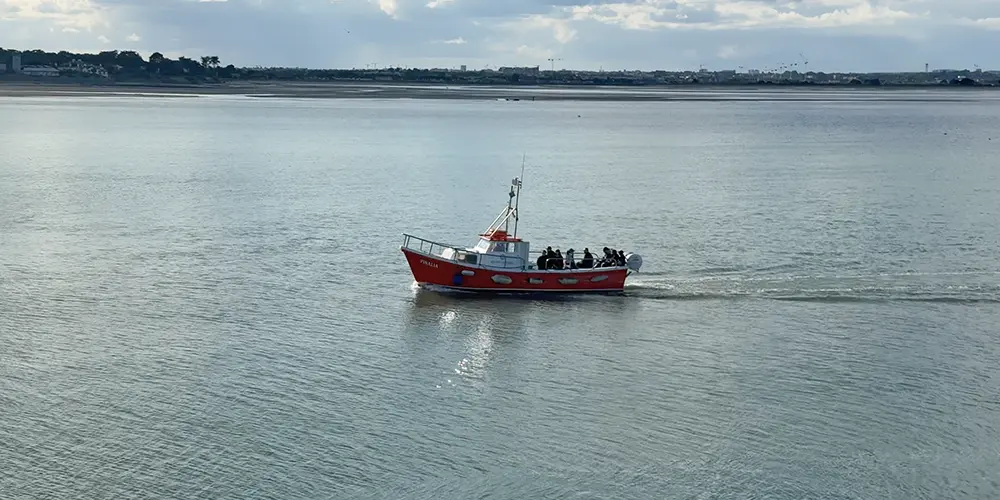 Aerial view of Ireland's Eye Ferry crossing Dublin Bay in Howth.