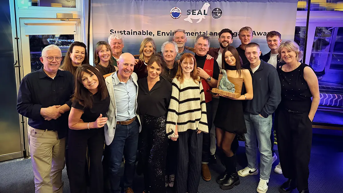 Group photo of Ireland's Eye Ferry Guides with their SEAL Award at ceremony.