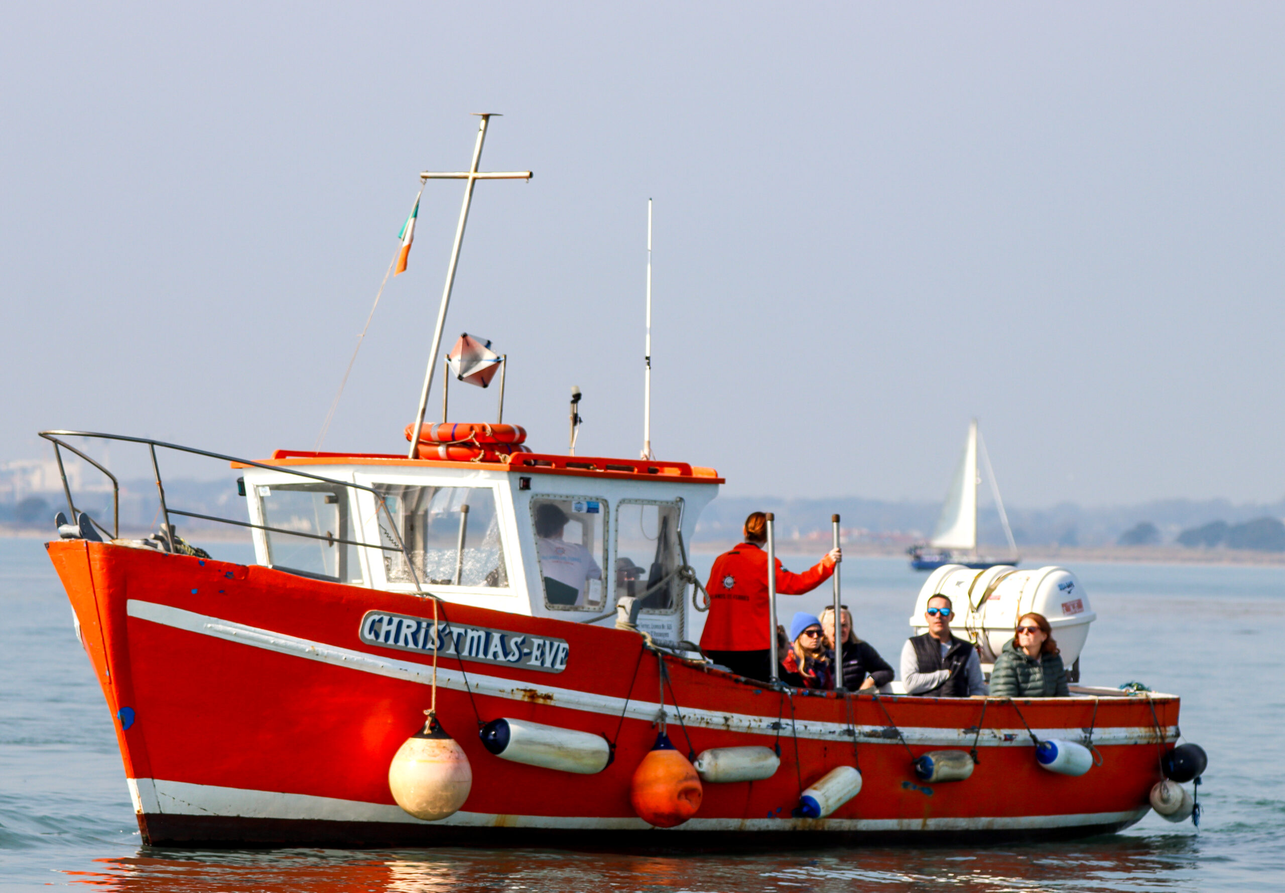 Ireland's Eye Ferry rounds the cliffs on Ireland's Eye